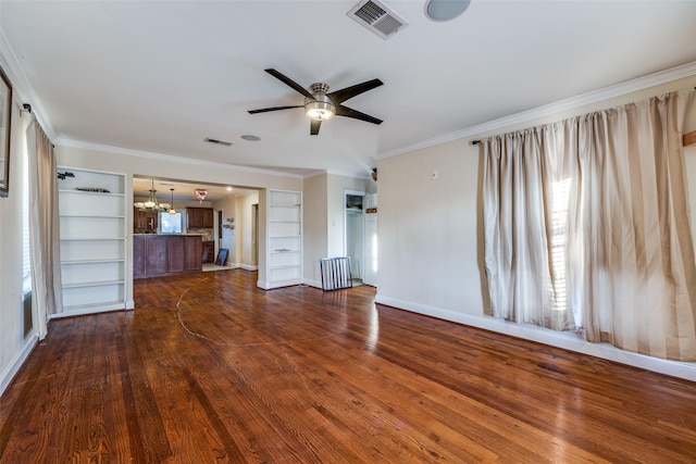 unfurnished living room featuring built in shelves, radiator heating unit, ceiling fan with notable chandelier, and dark hardwood / wood-style flooring