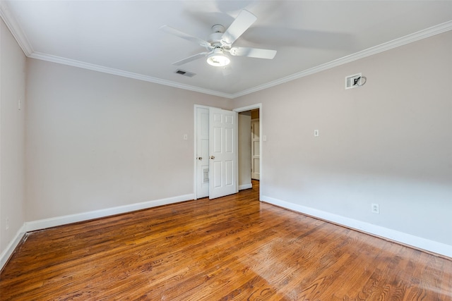 unfurnished room featuring ceiling fan, hardwood / wood-style floors, and ornamental molding