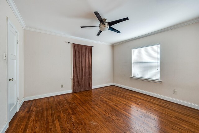 empty room featuring crown molding, ceiling fan, and dark wood-type flooring