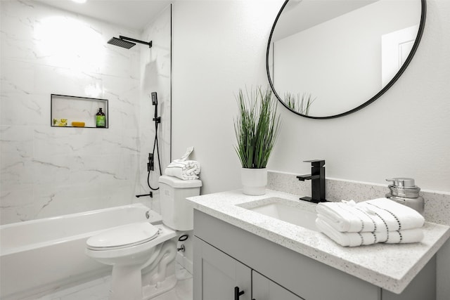 full bathroom featuring vanity, toilet, and tiled shower / bath