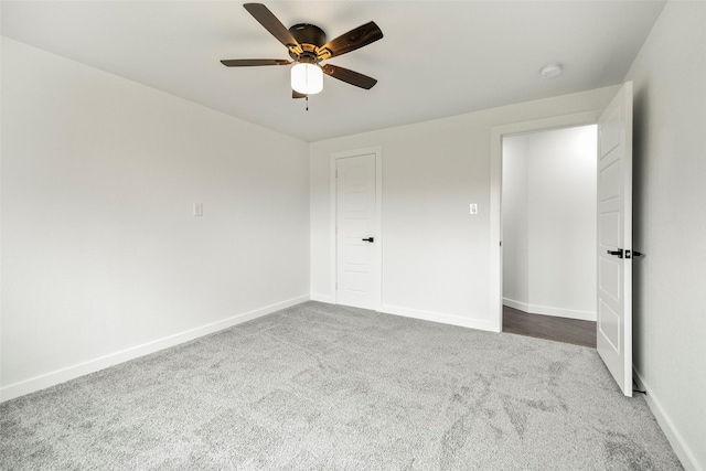 unfurnished bedroom featuring carpet floors and ceiling fan