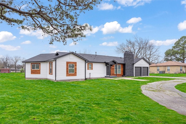 exterior space featuring a garage and a front yard