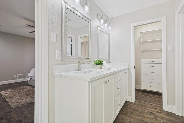 bathroom featuring vanity, ceiling fan, and hardwood / wood-style flooring