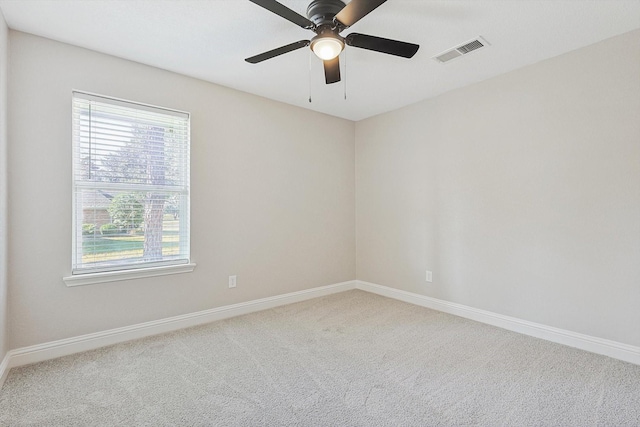 spare room with ceiling fan and carpet flooring