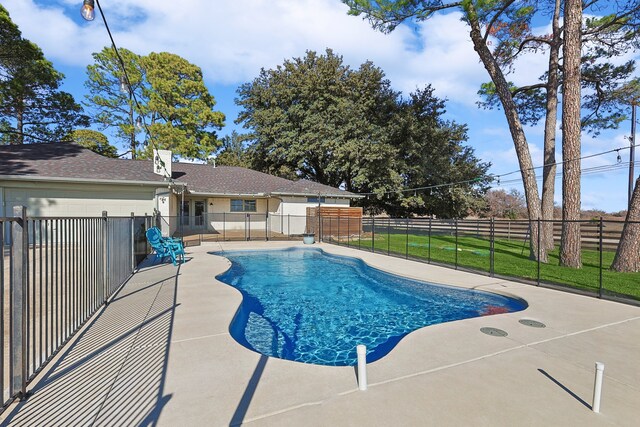 view of swimming pool with a patio