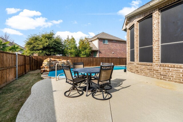 view of patio / terrace featuring a fenced in pool