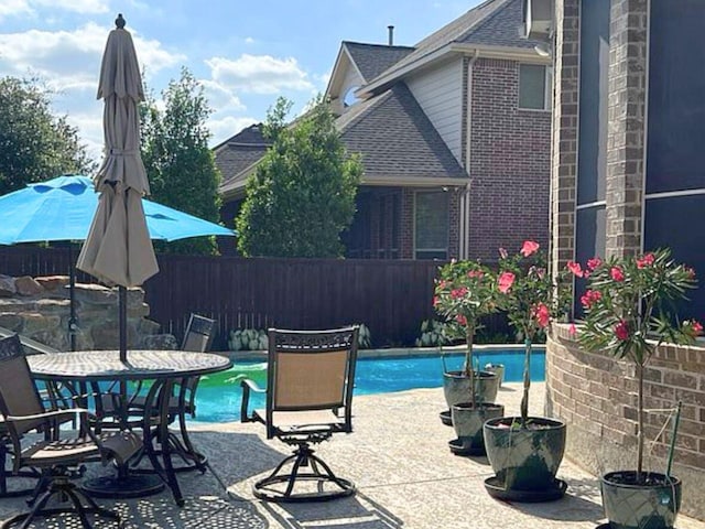 view of swimming pool with a patio area