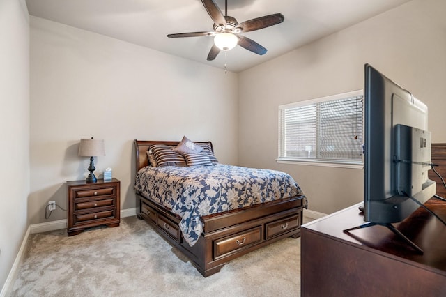 bedroom featuring ceiling fan and light colored carpet