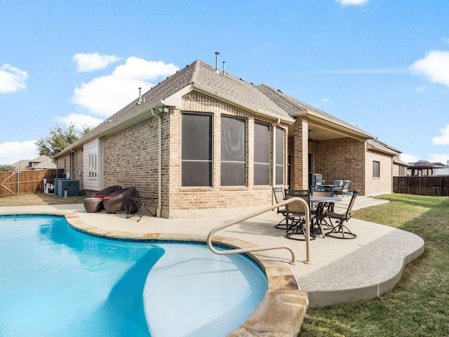 view of swimming pool featuring central AC and a patio area