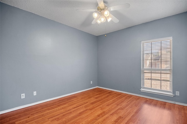 unfurnished room with a textured ceiling, ceiling fan, and light hardwood / wood-style floors