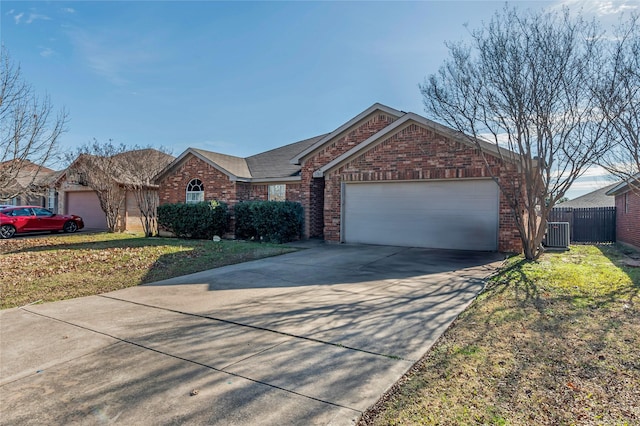 ranch-style house with central AC unit, a garage, and a front lawn