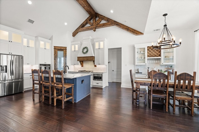 708 Glade Park Ct, Azle, TX 76020 - bedroom with light carpet, baseboards, a barn door, a tray ceiling, and a ceiling fan