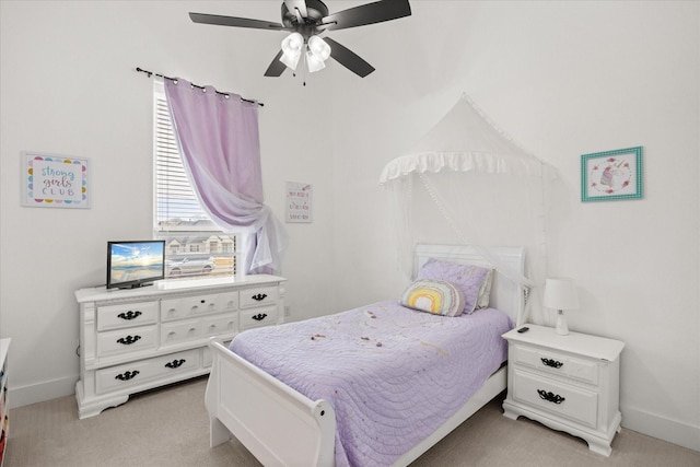 bedroom featuring ceiling fan and light carpet