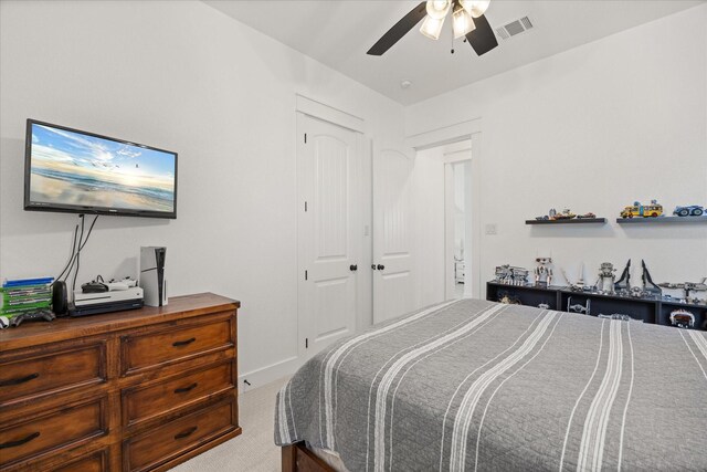 bedroom with carpet flooring, a closet, and ceiling fan