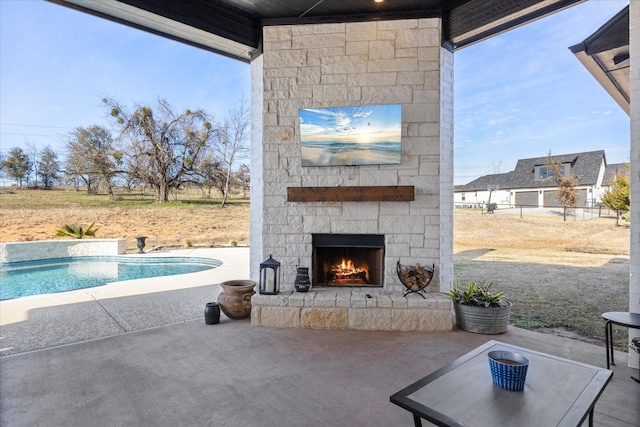 view of patio / terrace with an outdoor stone fireplace