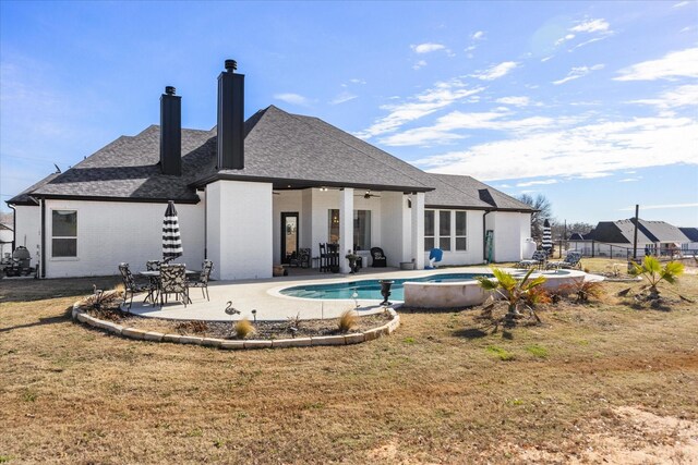 back of house featuring ceiling fan, a yard, and a patio