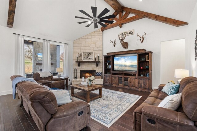 living room featuring dark hardwood / wood-style flooring, a fireplace, ceiling fan, high vaulted ceiling, and beamed ceiling