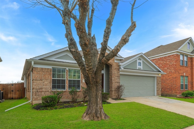 view of front of property with a garage and a front yard