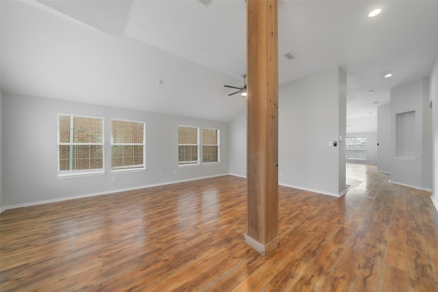 unfurnished living room featuring hardwood / wood-style flooring, ceiling fan, and lofted ceiling