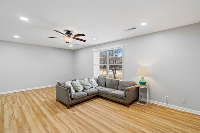 unfurnished living room featuring light wood-type flooring and ceiling fan