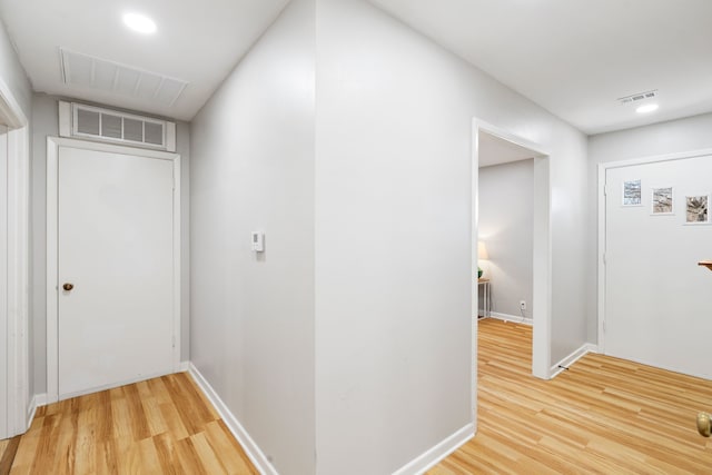 hallway featuring wood-type flooring