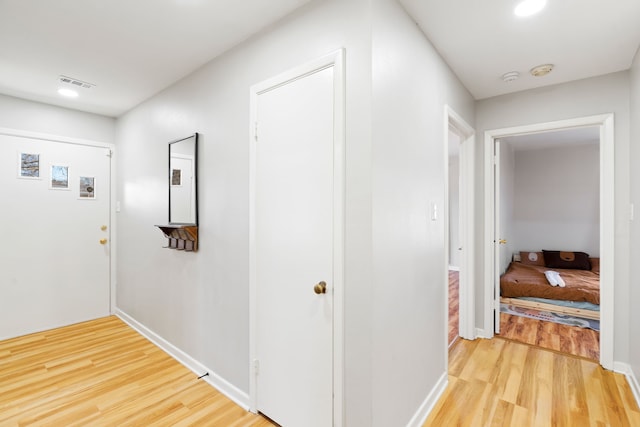 corridor featuring hardwood / wood-style floors