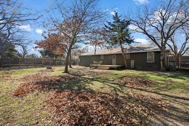 back of property featuring a yard