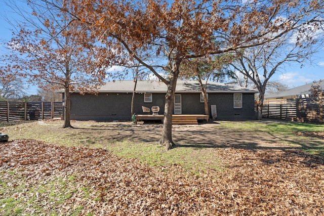 rear view of property with a wooden deck