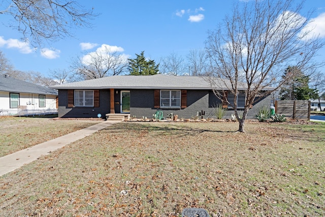 ranch-style home with a front lawn