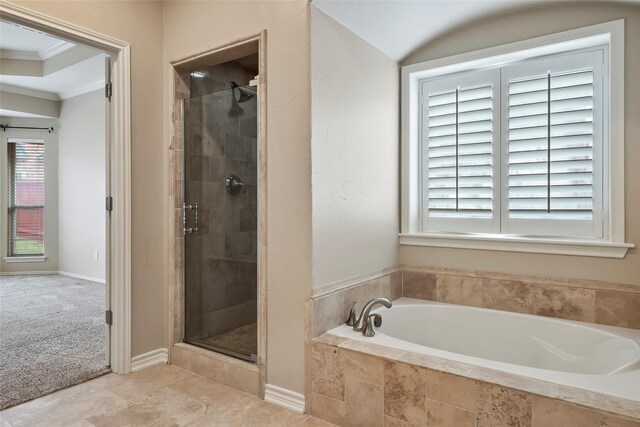 bathroom featuring shower with separate bathtub and crown molding