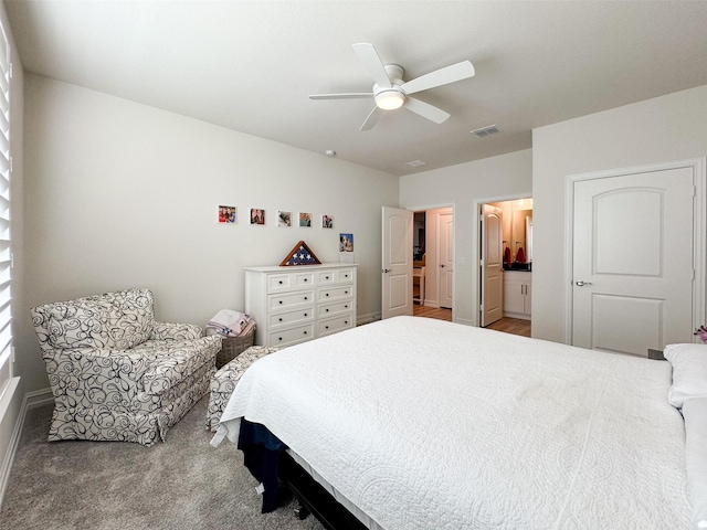 bedroom featuring connected bathroom, ceiling fan, and carpet floors