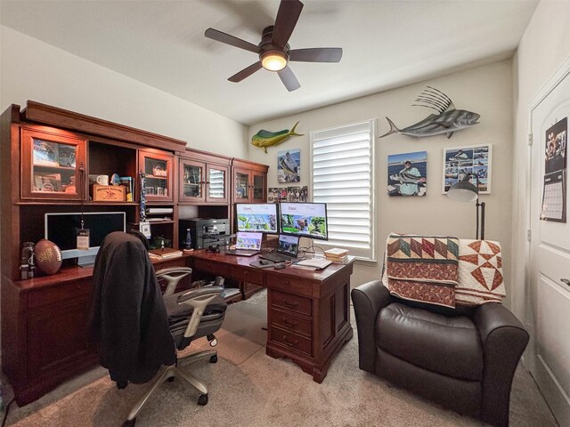 carpeted office with ceiling fan