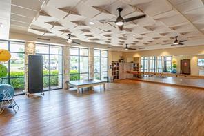 1133 Cornerstone Dr, Little Elm, TX 76227 - workout room featuring wood finished floors and a ceiling fan