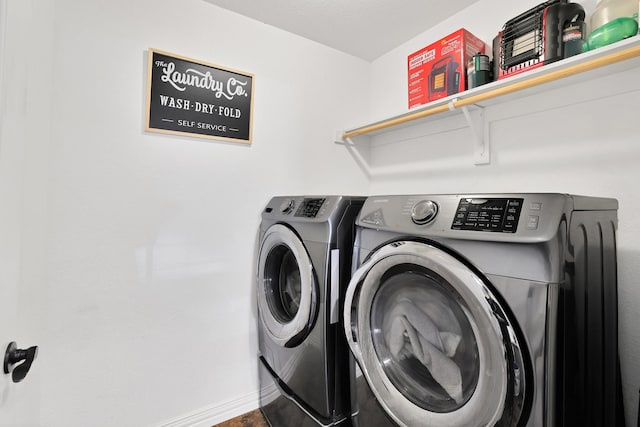 laundry room with washing machine and dryer