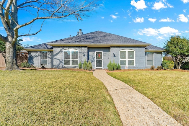 view of front of property with a front lawn