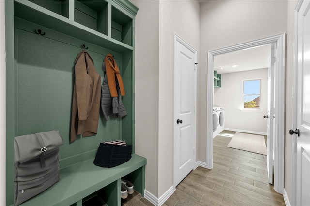 707 Shadle Rd, Poolville, TX 76487 - mudroom featuring light wood-style floors, independent washer and dryer, and baseboards