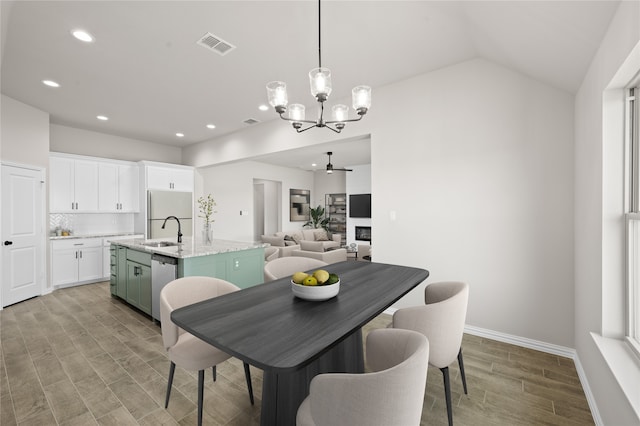 707 Shadle Rd, Poolville, TX 76487 - dining space featuring a chandelier, light wood-type flooring, recessed lighting, baseboards, and vaulted ceiling