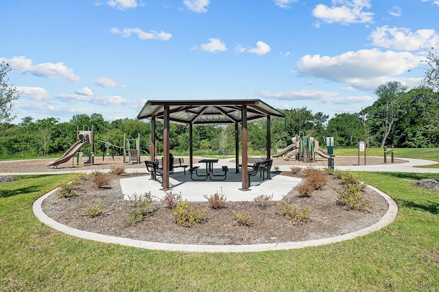 view of home's community featuring a playground and a yard