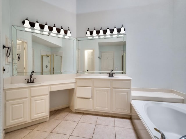 bathroom with tile patterned floors, vanity, and separate shower and tub