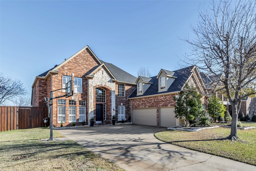 view of front facade with a front yard and a garage