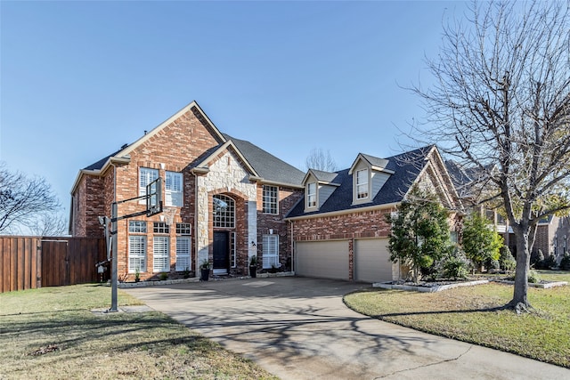 view of front facade with a front yard and a garage