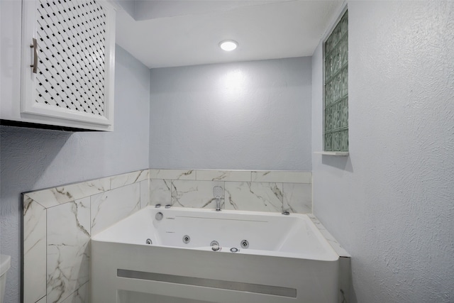 bathroom featuring a tub to relax in