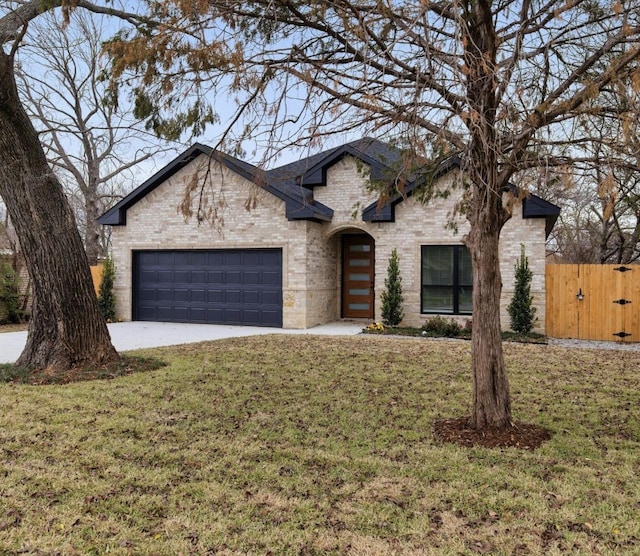 view of front of house with a front lawn and a garage