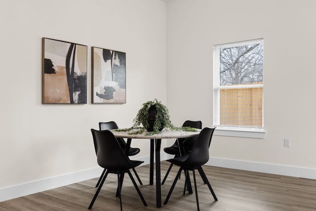 dining space featuring hardwood / wood-style floors