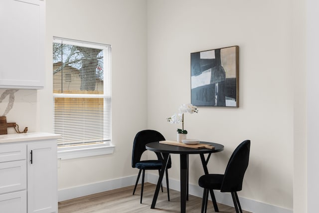 dining space featuring light wood-type flooring