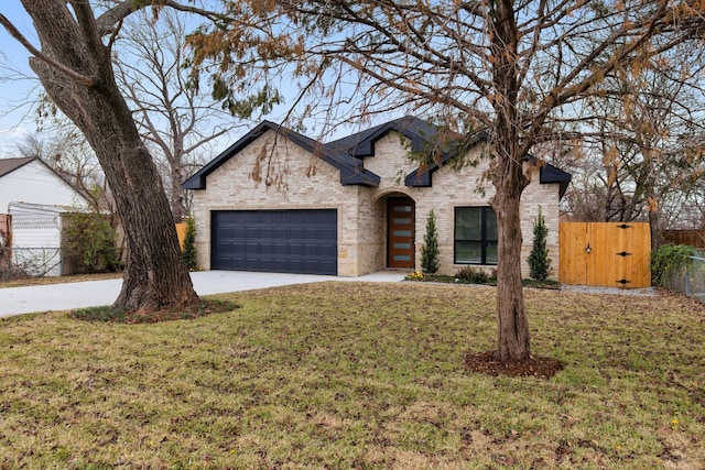 view of front facade with a front lawn and a garage