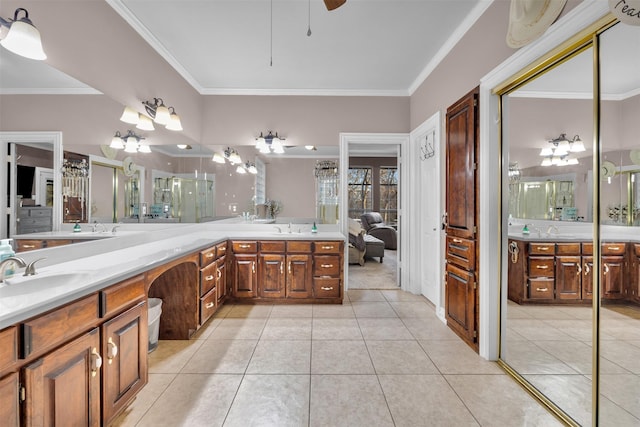 bathroom featuring tile patterned floors, vanity, and crown molding