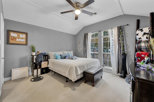 bedroom featuring ceiling fan, light colored carpet, and vaulted ceiling