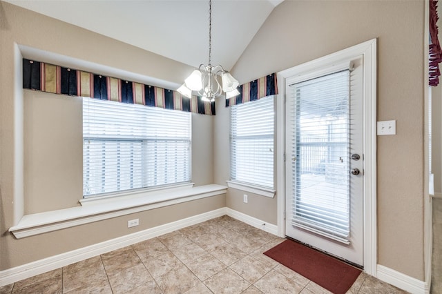 interior space featuring lofted ceiling, a chandelier, and tile patterned flooring