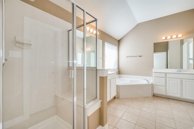 bathroom featuring vanity, tile patterned flooring, vaulted ceiling, and shower with separate bathtub